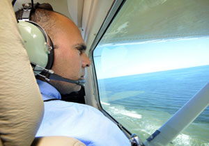 Biologist Alex Nunez surveys the Texas coast for red tide.