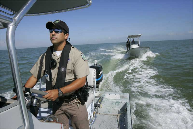 Fish and wildlife conservation officer or Game Warden, an image from Working and Careers in Water and Aquatic Science from the book Texas Aquatic Ecosystem Science by author Rudolph Rosen.