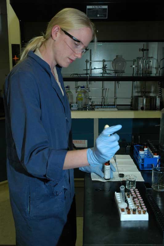 Picture of a water technician in an aquatic chemistry lab, An image in Texas Aquatic Science by author Rudolph Rosen.
