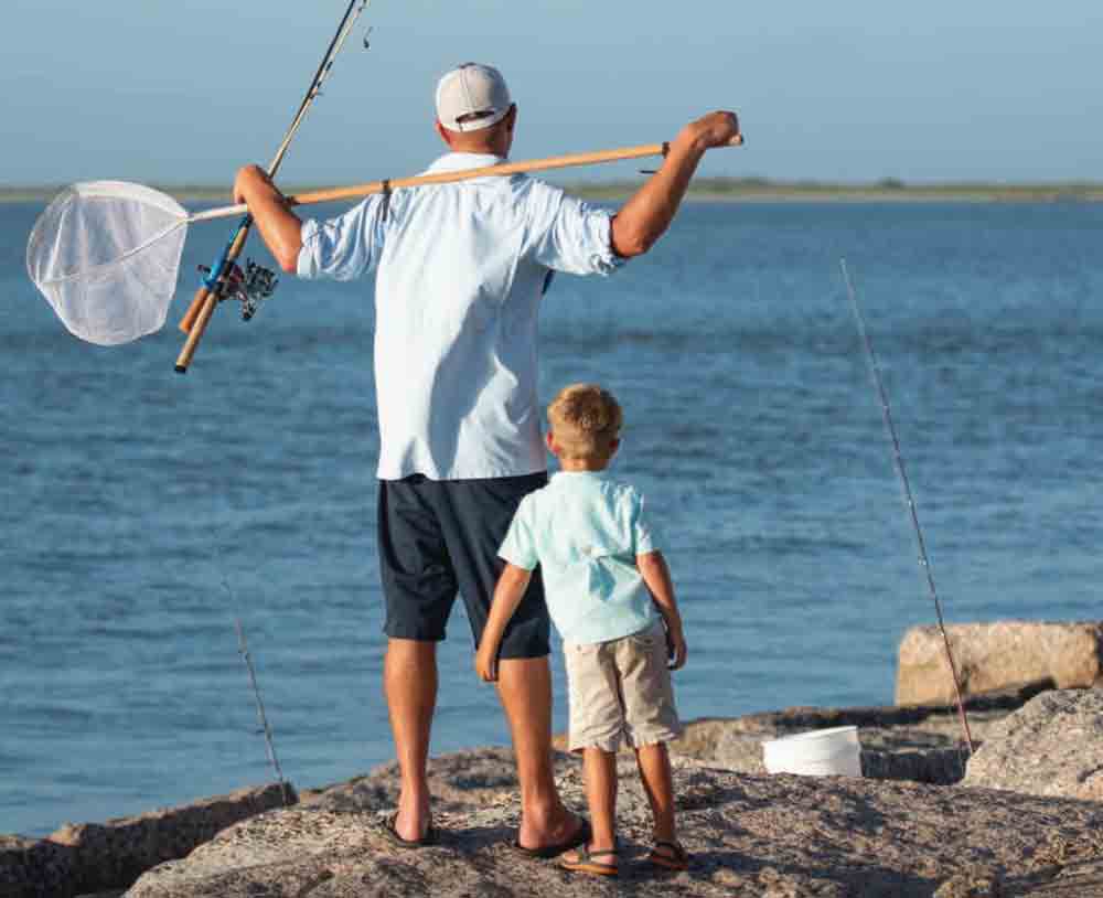 Father and son shore fishing.