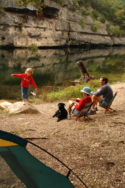 Family enjoying the outdoors at their campsite