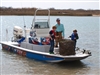 Volunteer and Sons Bringing in Abandoned Crab Trap, San Antonio Bay, 2-19-11