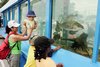 Visitors Enjoy a Mobile Freshwater Aquarium at Expo
