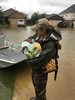 Game Warden Holding Baby During Evacuation