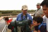 Smiley Nava Shows Youngster Spotting Scope Atop Hawk Tower