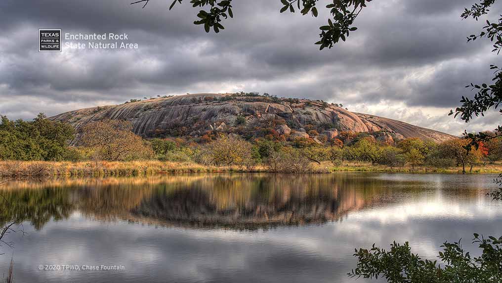 Dome reflected in lake at Enchanted Rock State Natural Area