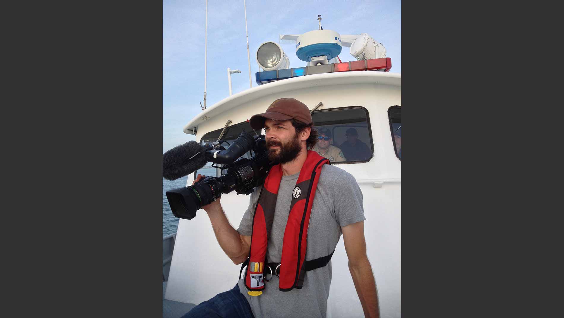 Kyle Banowsky on a game warden boat in the Gulf of Mexico.
