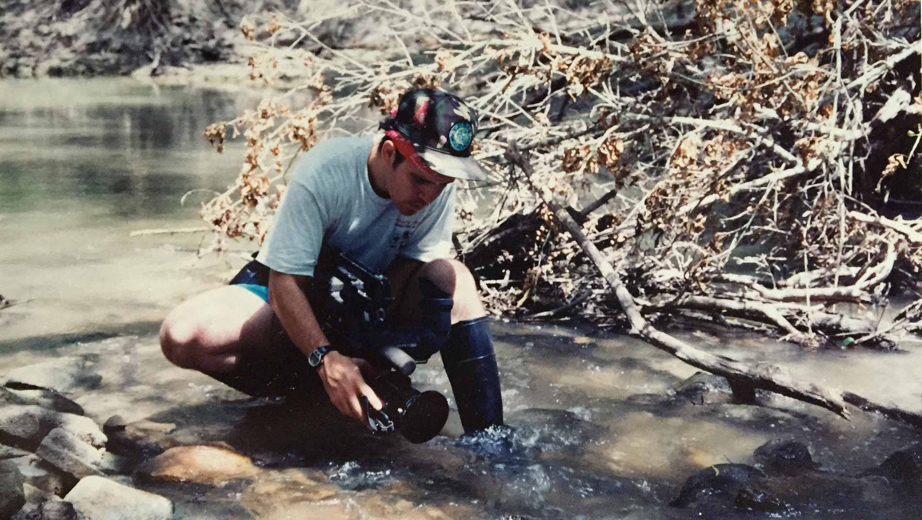Randall Maxwell recording the ripples in a Texas stream.