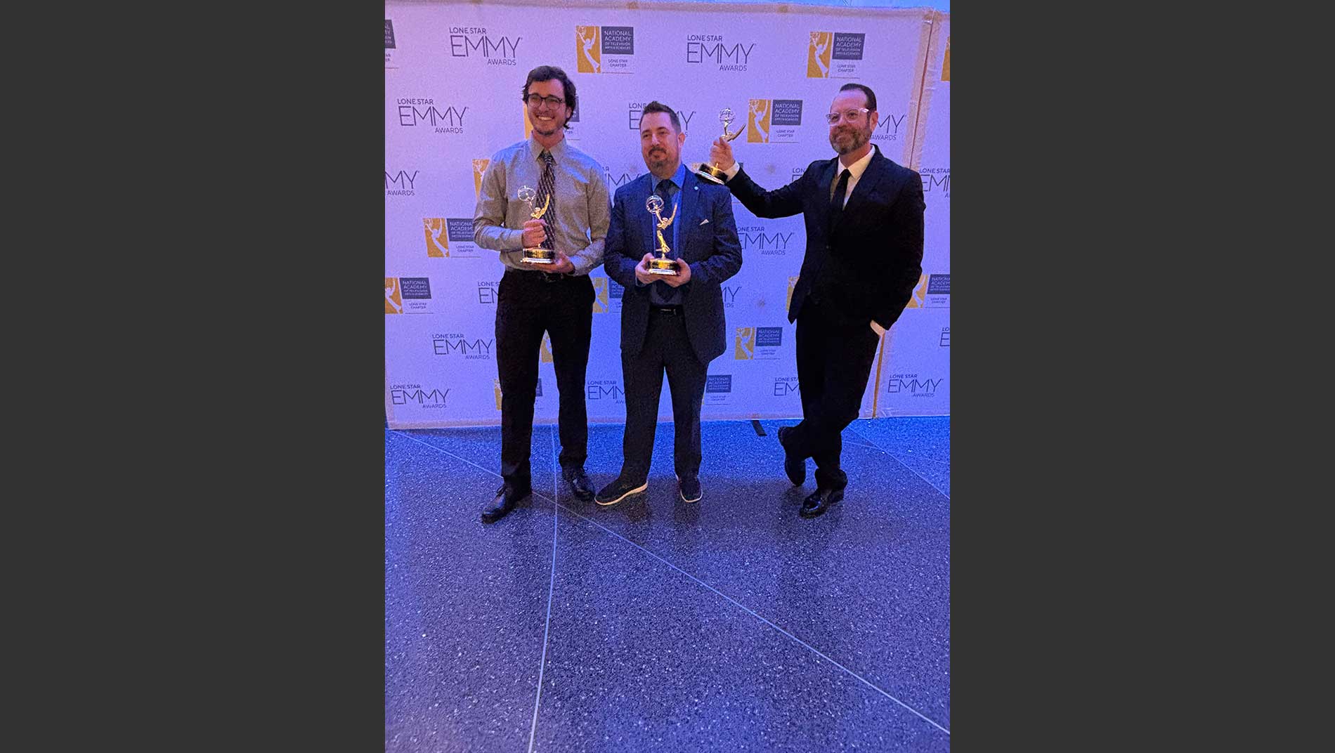 Bryce Spangler, Dave Flanders, and Jake Herrle accepting award at 2024 Lone Star EMMYs.