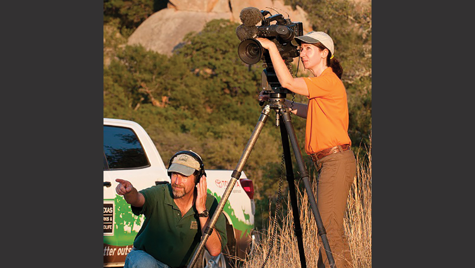 Producers Alan Fisher and Whitney Bishop on location at Enchanted Rock State Park.