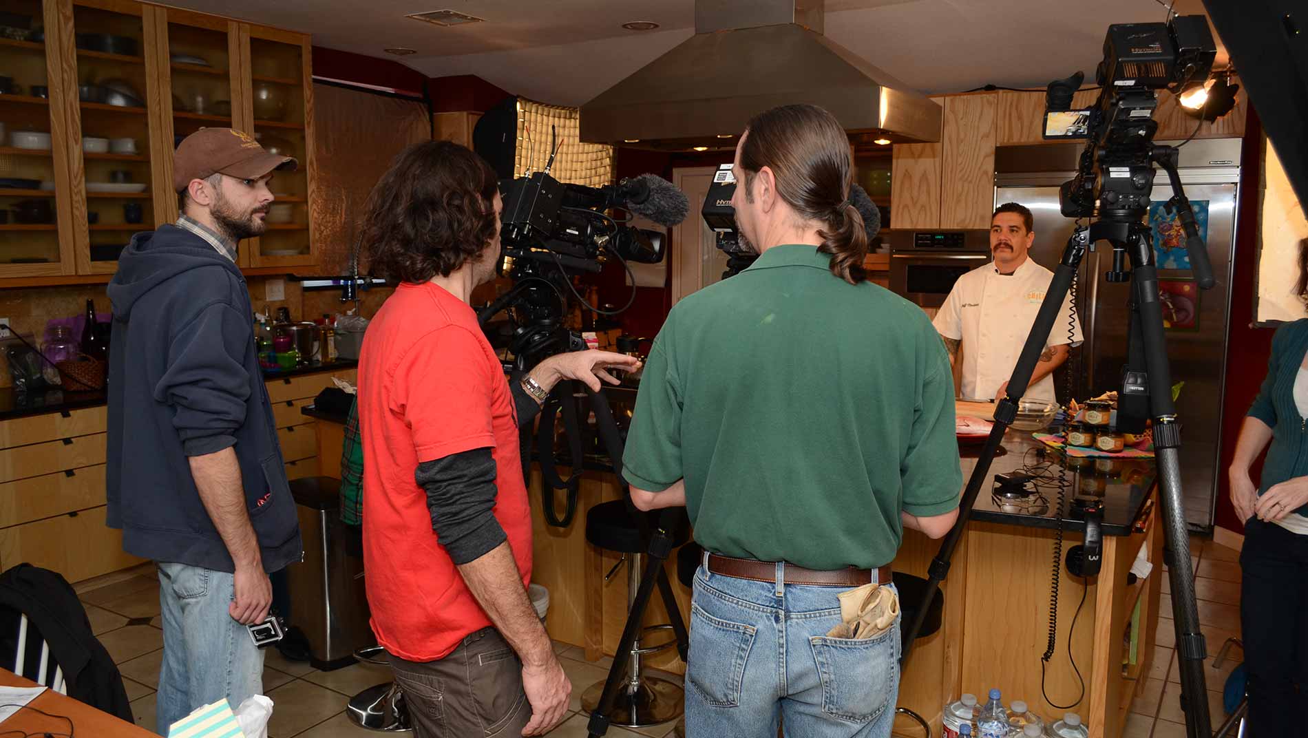 Kyle Banowsky, Abe Moore and Alan Fisher shoot a wild game cooking segment with chef Jeff Martinez.