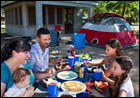 A family camping at a Screened Shelter.  