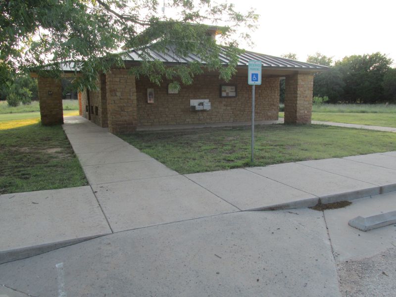 Restrooms with showers across from the shelter area.