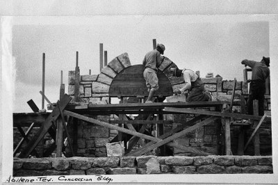 CCC men building a rock arch.
