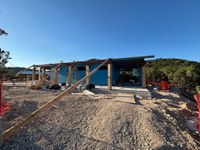 View of the back of the nature center, with construction equipment.