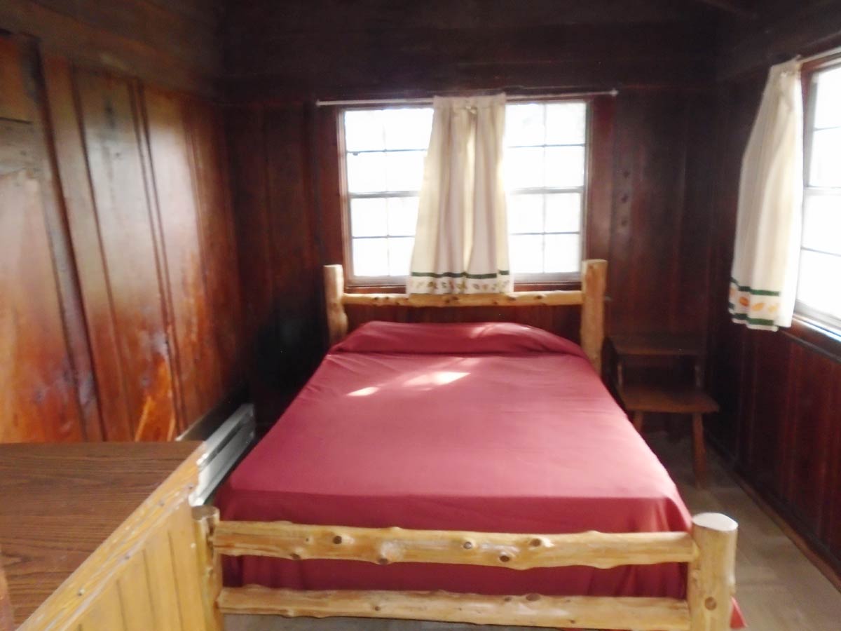There is a double bed in each of the two bedrooms of Cabin 10.