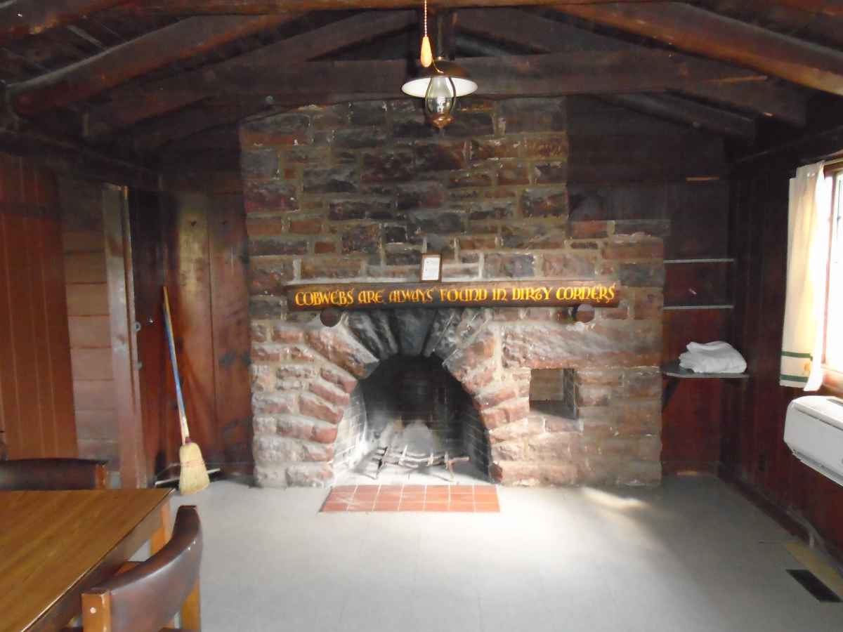 Cabin 11 has a fireplace in the living area. 