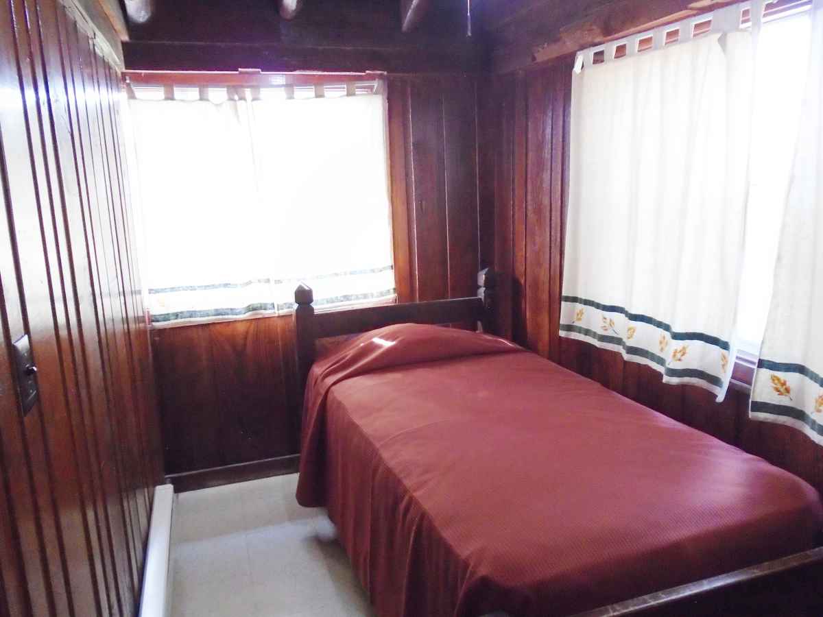 The bedroom in Cabin 11 has a single bed.