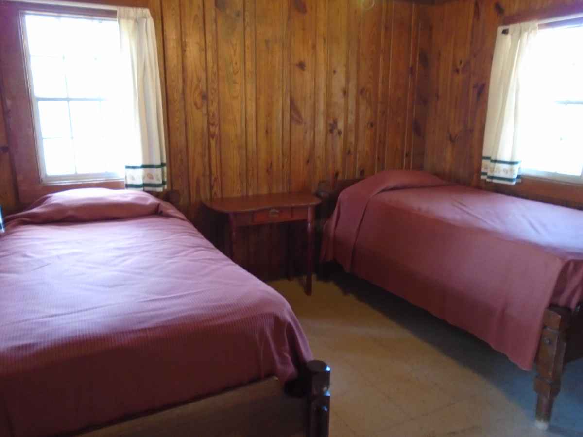 Bedrooms 3 and 4 have two single beds .