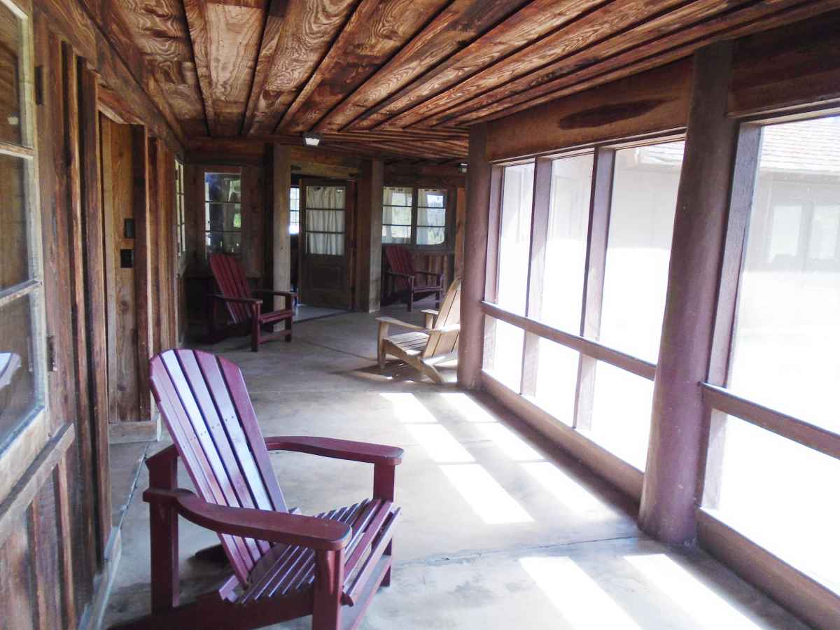 Cabin 12 has a huge, back screened-in porch.