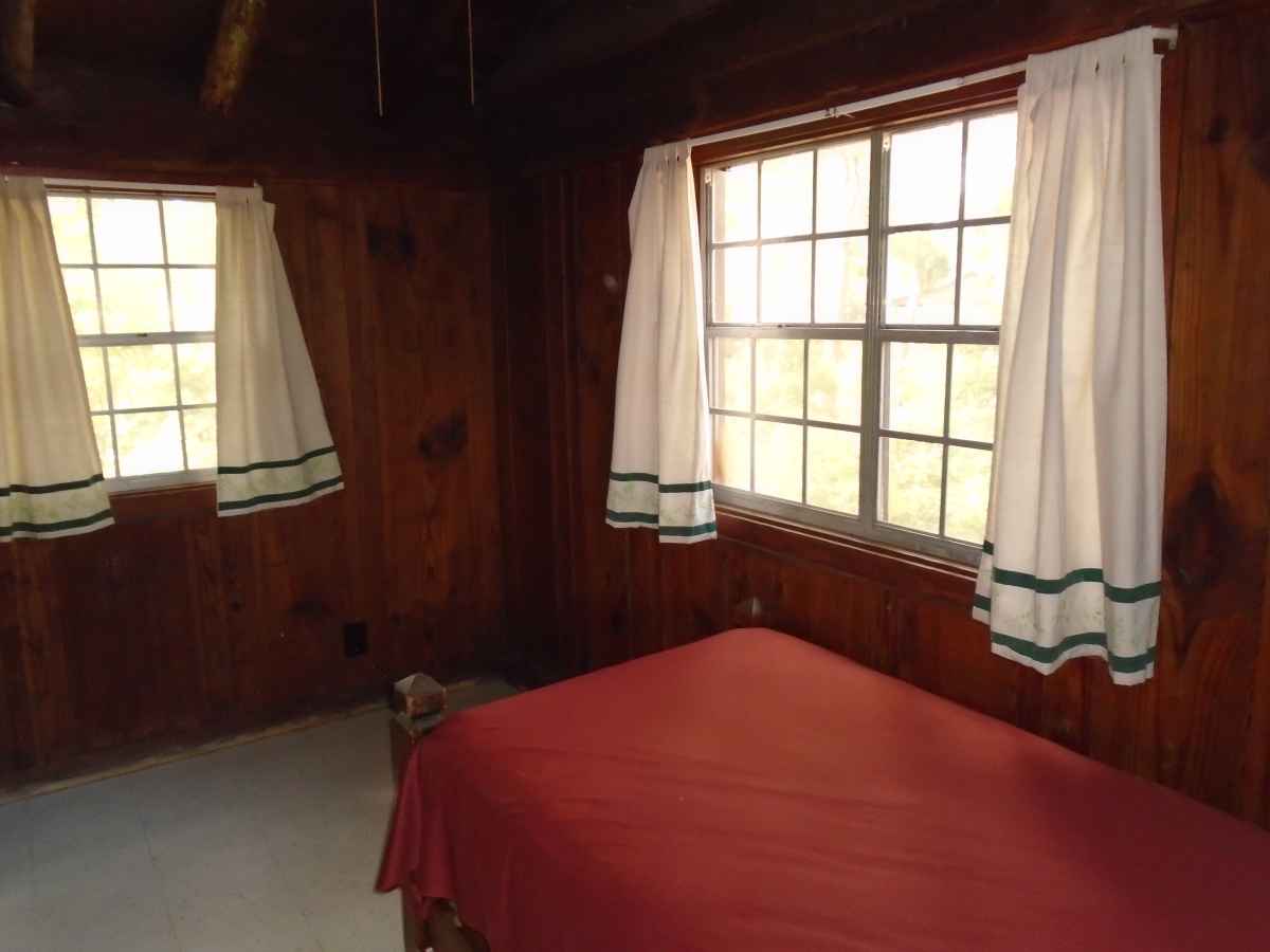 Bedroom 2 of Cabin 7 has a single bed. 