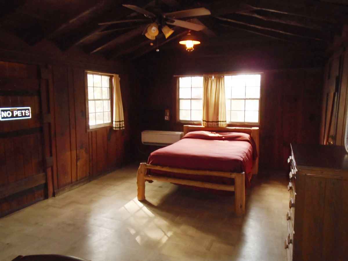There is one double bed in the living area of Cabin 8.