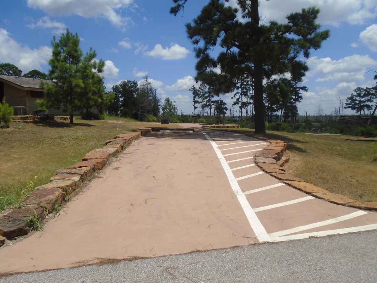 Accessible Campsite #28 is close to the bathrooms and has a raised fire ring, upright grill, lantern post, picnic table and paved walkways designed for use with a wheelchair.  