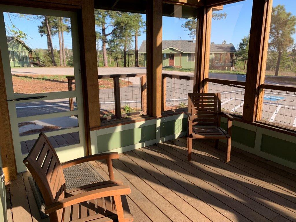 Inside Dorm 1 screened porch. 