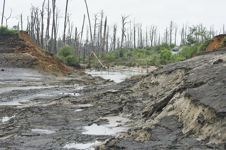 Broken dam and empty lake 