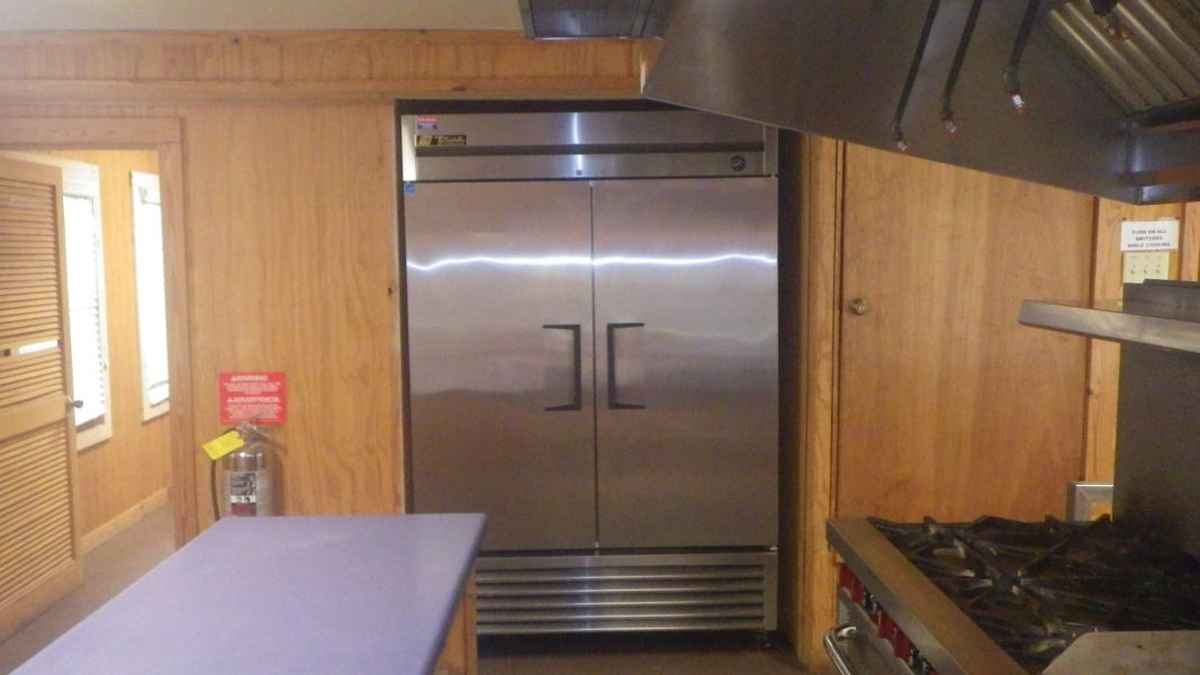 Looking at the commercial refrigerator in the Dining Hall kitchen.   