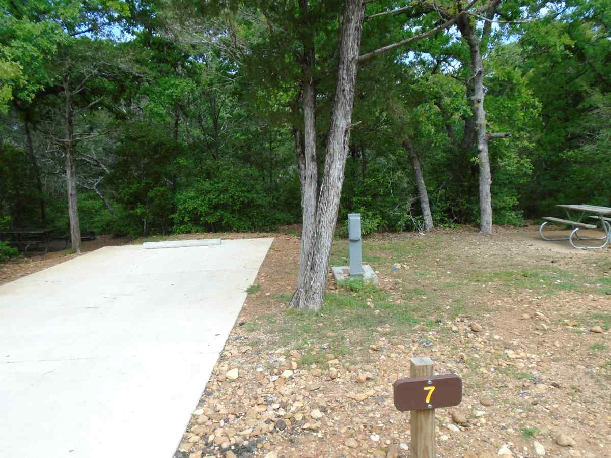 Campsite #7 and the picnic table for campsite #8 in Cozy Circle Camping Area.