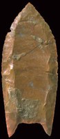 carved red stone arrowhead point