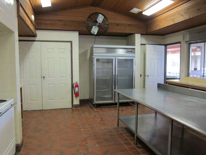 Lots of shelves, prep area, and a commercial refrigerator.  