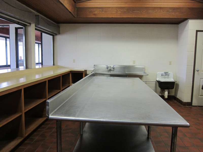 Lots of shelves, prep area, and sinks.  
