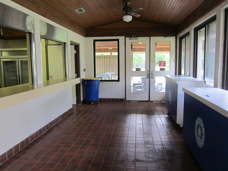 This hallway connects the gymnasium/stage to the kitchen/serving area, and the outside covered dining area.   