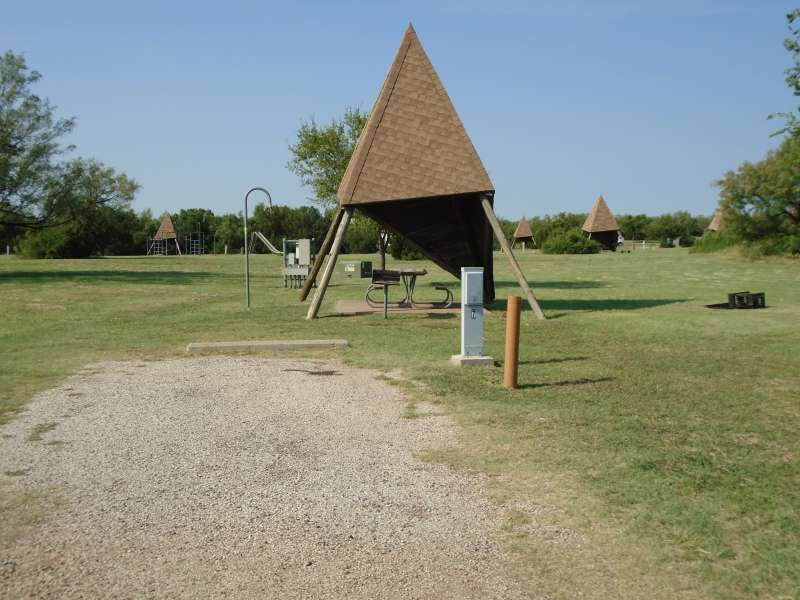 Campsite #7, with the playground in the background, in the Comanche Camping Area.