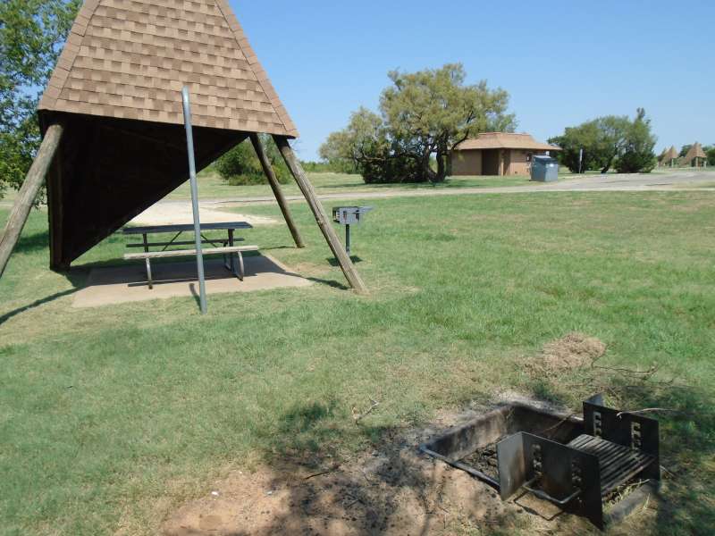 Campsite #12, with the bathrooms in the background, in the Comanche Camping Area.