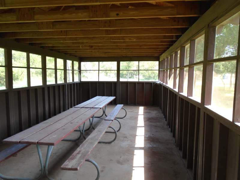 3-picnic tables are inside the screened pavilion. 