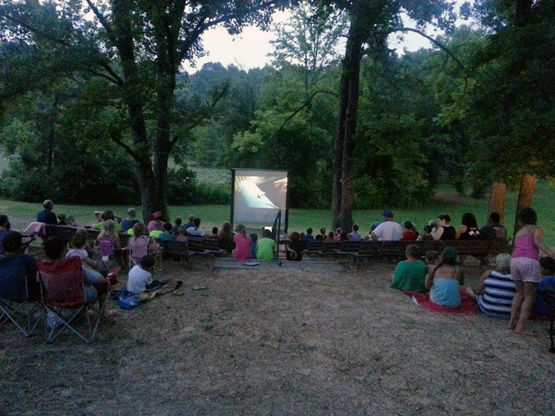 Showing a movie at the amphitheater. 
