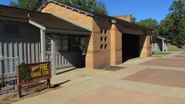 Back side of building, with recreation hall in the back and park store in the foreground.
