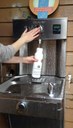 Person filling water bottle 