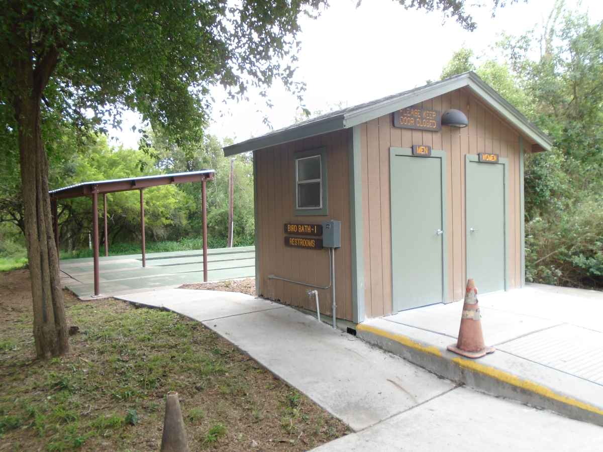 The outside mens and womens restrooms for Pauraque Hall.