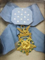 gold medal on blue ribbon