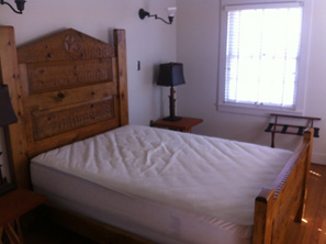 The master bedroom has a queen bed. 
