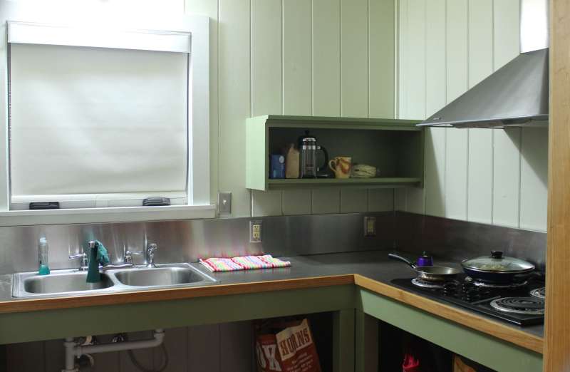 Inside the kitchen. This cabin was occupied when photographed; there are personal items in the photos that are not included with the cabin.