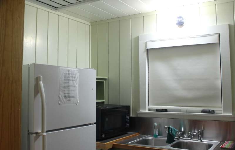 Inside the kitchen. This cabin was occupied when photographed; there are personal items in the photos that are not included with the cabin.