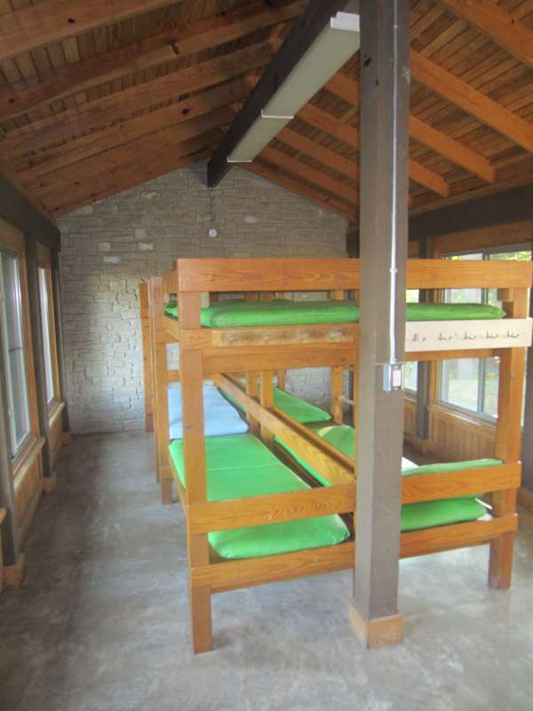 Inside one of the four Shelters with A/C, heating, and four sets of bunkbeds.