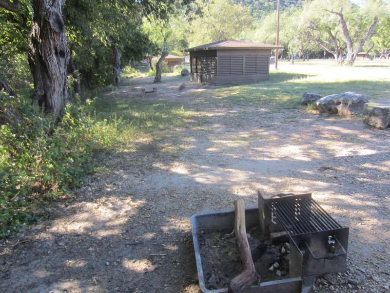 A fire ring (square) with adjustable grill comes with all the Screened Shelters. 