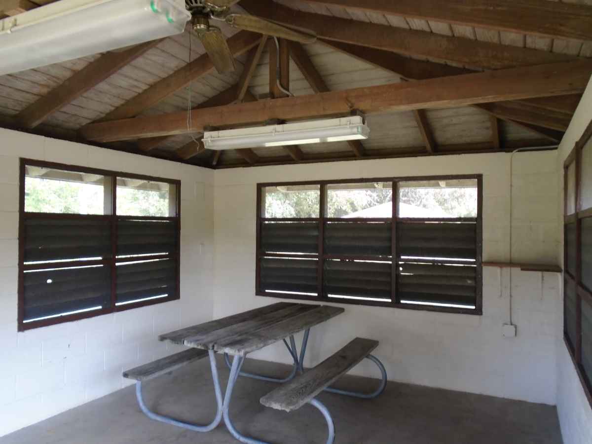 Inside #3; a picnic table, lights, a ceiling fan, and an electrical outlet is in every shelter.    