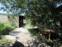 sidewalk winding between rock walls